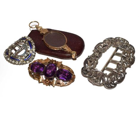 A Victorian amethyst set oval brooch, a silver figural buckle, a small paste set buckle, and a pair of pinch-nez (4) 