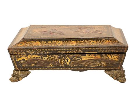 A Regency japanned box of sarcophagus form, decorated to the cover with oriental figures in a garden landscape, with fitted i