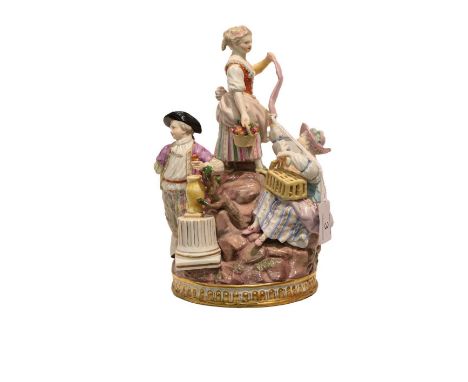 A Meissen figure group, circa 1900, modelled as two girls and a boy in 18th century costume holding flowers and a basket, on 