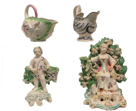 A Derby dolphin form cream boat decorated in underglaze blue, a Derby leaf shaped sauceboat, and two Derby figures circa 1770