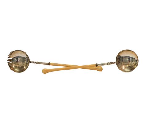 A pair of Victorian silver and ivory salad servers, by George Adams, London, 1881, each with ivory handle and round bowl, the