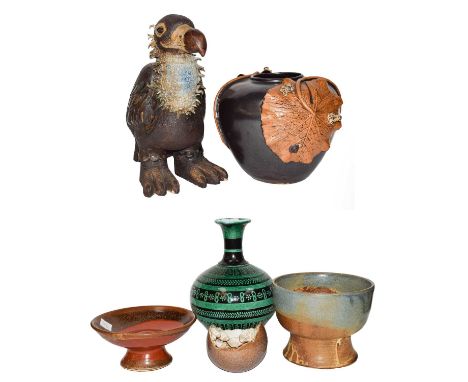 Six items of pottery, comprising: a model of a Eurasian Black Vulture, 38.5cm high; three differing bowls; a further bowl app