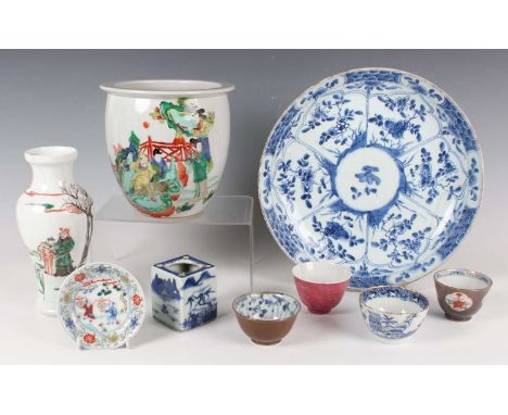 A small group of Chinese porcelain 18th century and later, including a blue and white saucer dish, Kangxi period, painted wit