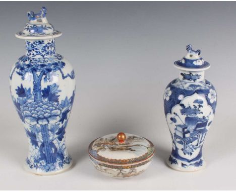 A Chinese blue and white porcelain vase and cover, mark of Kangxi but late 19th century, painted with birds, blossoming branc