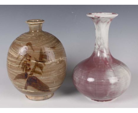 Two Japanese studio pottery vases, 20th century, comprising a pinky red glazed porcelain bottle vase with globular body and f
