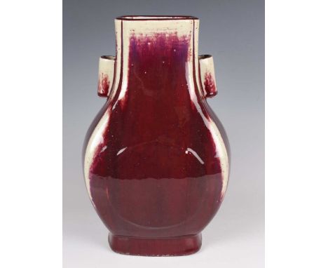 A Chinese flambé glazed rectangular pear shaped hu vase, mark of Guangxu and probably of the period, the body covered in a ri