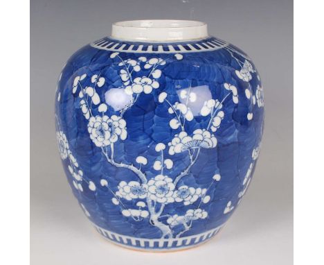 A Chinese blue and white porcelain ginger jar, mark of Kangxi but late 19th century, of stout ovoid form, painted with branch