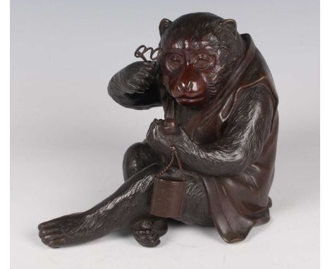 A Japanese brown patinated bronze figure of a seated monkey by Hideyoshi Kansei, Meiji period, modelled wearing a sleeveless 