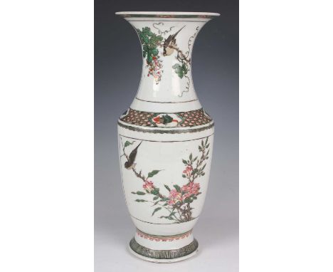 A Chinese famille verte porcelain vase, Kangxi style but late 19th century, the shouldered tapering body and flared neck pain