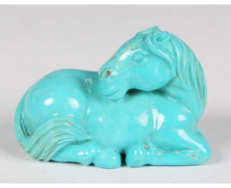 A Japanese carved turquoise netsuke, Meiji/Taisho period, modelled as a recumbent horse, length 5.2cm.