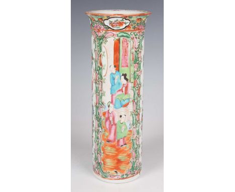 A Chinese Canton famille rose porcelain cylinder vase, mark of Kangxi but late 19th century, painted with panels of figures, 