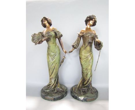 Pair of French cast spelter figures of society ladies with polychrome detail, signed L. Alliot, each 40 cm high (2)