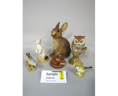 A collection of Aynsley figures of British wildlife subjects including otters, badger, owls, various native birds, roseate te