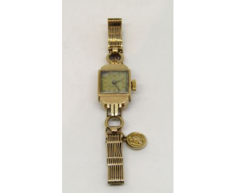 Ladies automatic 9ct cocktail watch in the art deco manner, with Dennison case and gate link bracelet, with associated yellow