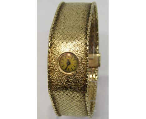 Ladies Cortebert 9ct cocktail watch, with thick mesh strap, circular champagne dial with baton markers and unusual clasp mech