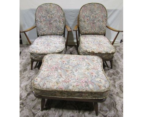 An Ercol stained beechwood four piece suite comprising a low three seat hoop and stick back sofa, with open down swept arm, t