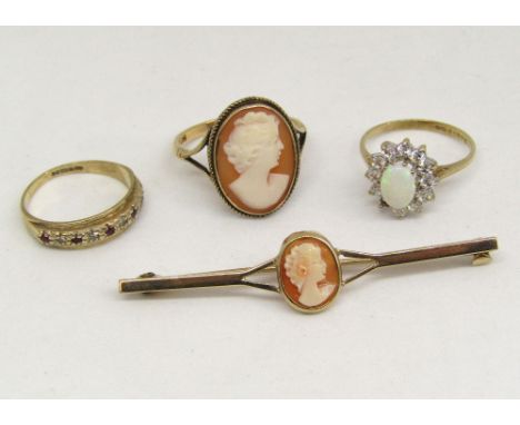 Group of 9ct jewellery comprising a garnet and diamond set ring, size I/J, a cameo bar brooch and similar ring each depicting