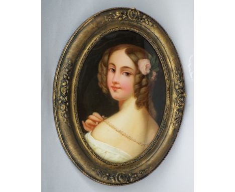 19th century school - Bust length portrait of a young woman in pearl necklace, reverse painted convex glass panel of oval for