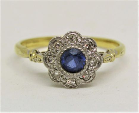 18ct sapphire and diamond daisy cluster ring, size M/N, 2.5g
