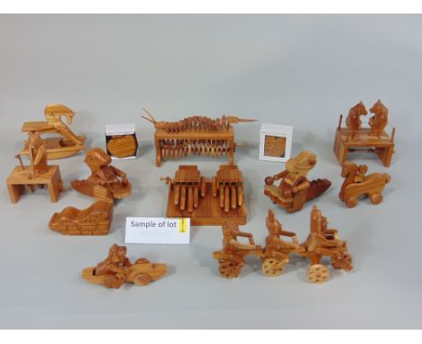 Collection of hand made wooden traditional toys including puzzle boxes and articulating figures eg, boxing bears, linked cycl