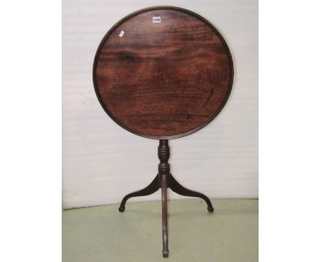 A 19th century mahogany snap top occasional table, the circular tray top raised on a turned pillar and tripod 60 cm diameter 