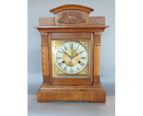 Oak cased architectural two train mantel clock, the brass dial with silver chapter ring engraved with Roman numerals, with qu