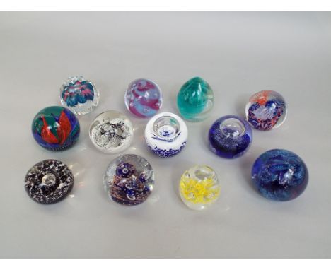 Collection of twelve various good quality paperweights by Caithness and others (12)