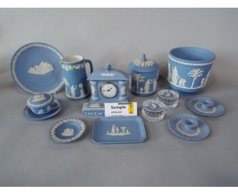 A collection of Wedgwood blue ground Jasperwares including a pair of cachepot, further cachepot, pair of vases, a two handled