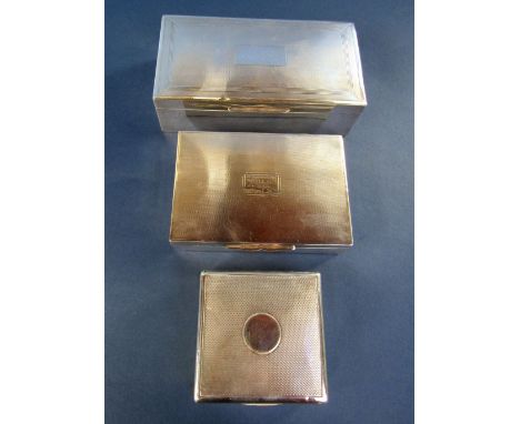 Three engine turned cigar boxes, each with cedar lining, the largest 17 cm long (3)
