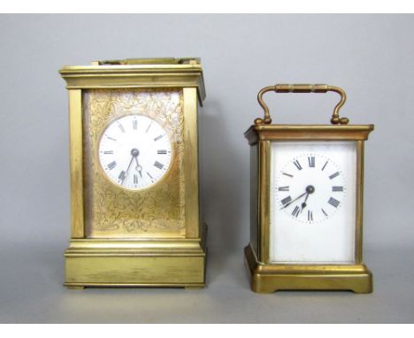 Large brass cased carriage clock, with gilt mask and circular enamel dial, 15cm high, together with a further smaller carriag