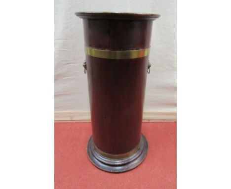 A cylindrical brass banded umbrella/stickstand with removable tin liner, brass lions mask and ring handles and moulded base, 