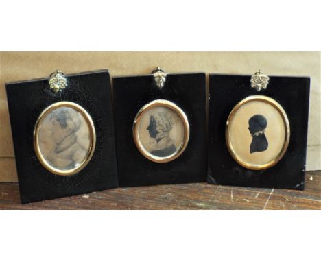 A collection of eight miniature silhouette portraits showing four ladies, three gentlemen and a child, all in 19th century st