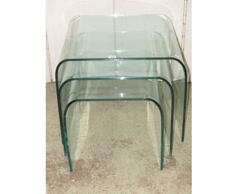 A nest of three good quality graduated, light green tinted moulded glass occasional tables, possibly Italian