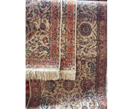 Keshan type Indian runner with various scrolled foliage upon a light ground, 360 x 95cm; together with a further pair of smal