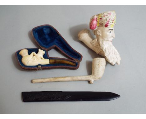 A Jacobs clay pipe bowl by Gambier of Paris, a further cheroot holder and case and an Irish timber letter knife