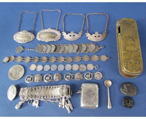 A mixed collection of bijouterie silver to include four decanter labels, a collection of silver coin bracelets, one fitted wi