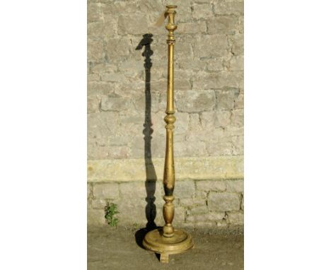 An Edwardian/1920s standard lamp with turned stem circular base and chinoiserie detail on a gold background