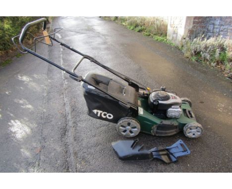 An Atco Quattro 195 self propelled petrol driven rotary lawn mower with grass collection bag
