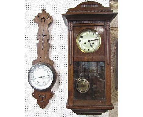 Ecclesiastical oak banjo type barometer, with enamel dial and studded crucifix, 84cm high; together with a vintage drop dial 