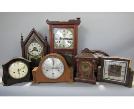 A box containing a mixed collection of clocks to include a Bakelite two train Smiths example, an architectural shelf clock, a