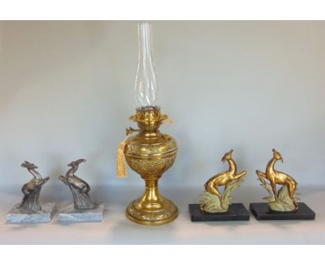 A mixed miscellaneous lot to include two pairs of prancing deer in the Art Deco manner, a further brass oil lamp and a cast r