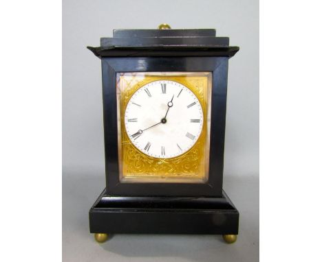 Small French mantel clock with ebonised case and gilt mask, circular enamel dial with Roman numerals, 20cm high, pendulum