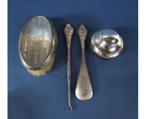 A mixed lot to include a silver topped dressing brush, a silver button hook and shoe horn and a further silver topped glass i