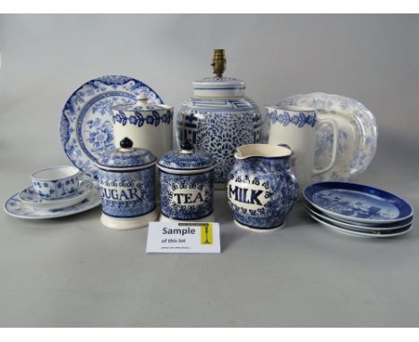 A pair of Emma Bridgewater tea and sugar storage jars and covers with blue sponged decoration together with a matching milk j