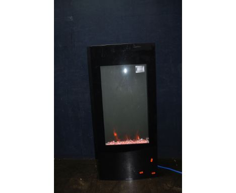 A FOCALPOINT EF11-16 MODERN GLASS FIRE EFFECT HEATER with 'crystal coals', colour change lighting, clock (PAT pass and workin