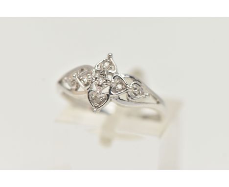 A 9CT WHITE GOLD DIAMOND RING, floral open work design, set with single cut diamonds, open work shoulders leading onto a poli