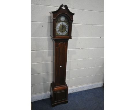 A 20TH CENTURY MAHOGANY TEMPUS FUGIT LONG CASE CLOCK, the arched dial enclosing a seven inch brass and silvered dial, depicti