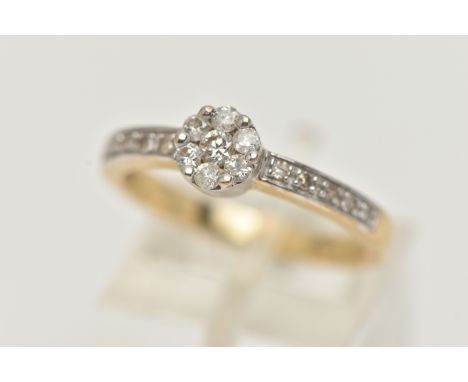 A 9CT GOLD DIAMOND CLUSTER RING, small round cluster set with seven round brilliant cut diamonds, in a white metal mount, to 