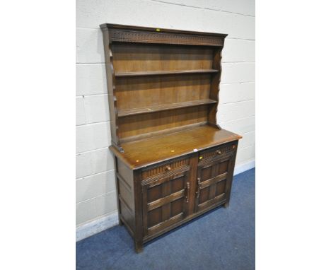 A DARK ERCOL DRESSER, the top two tier plate rack above two drawers and two cupboard doors, width 122cm x depth 47cm x height