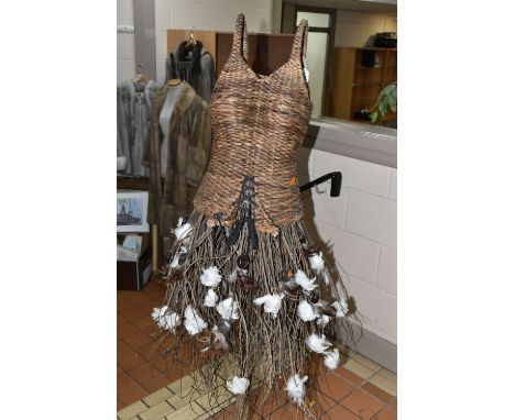 AN AUTUMNUL WICKER DISPLAY MANNEQUIN, on a rustic wooden stand, wicker bodice and tree branch and feather skirt (1) (Conditio